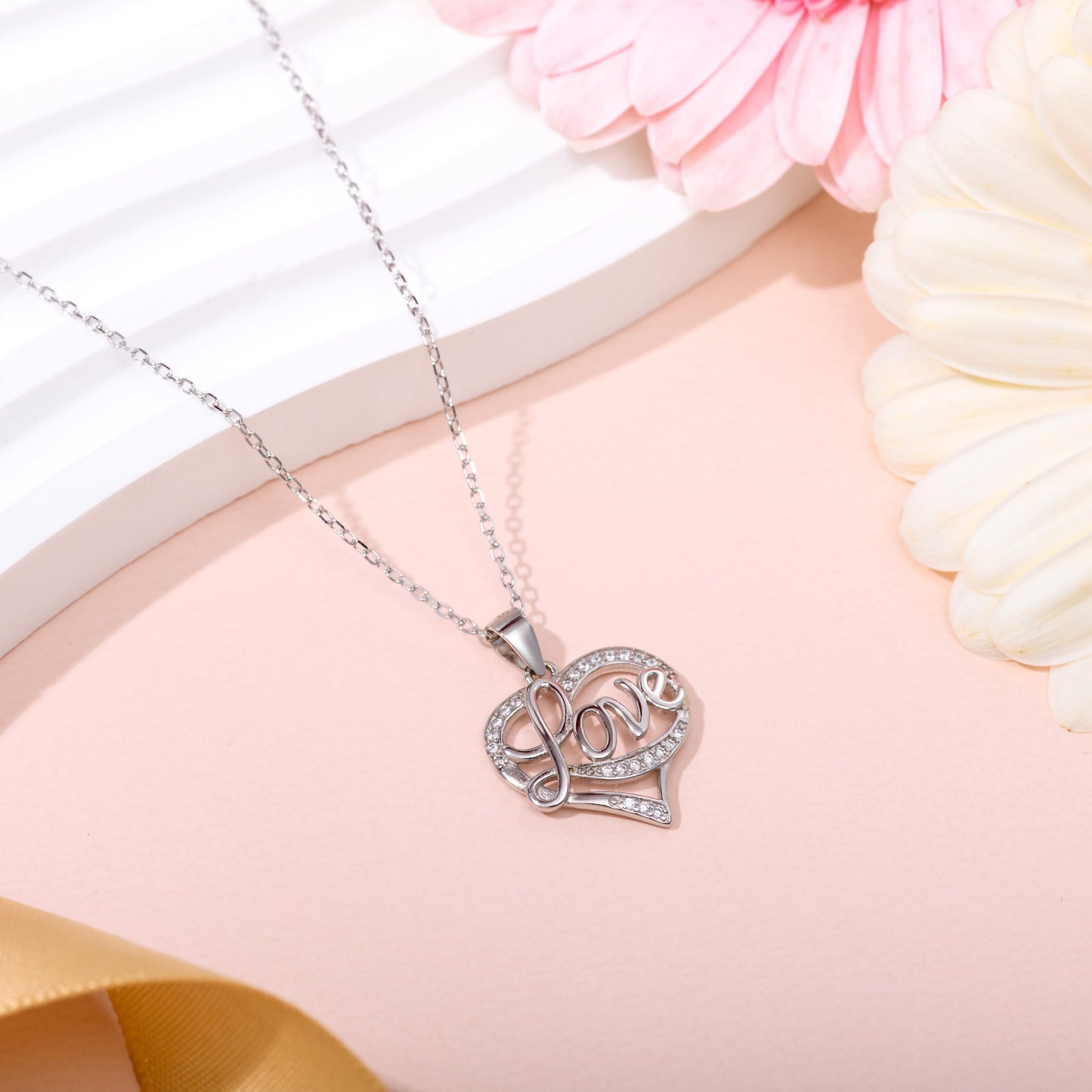 Heart Necklace with the word "Love" written